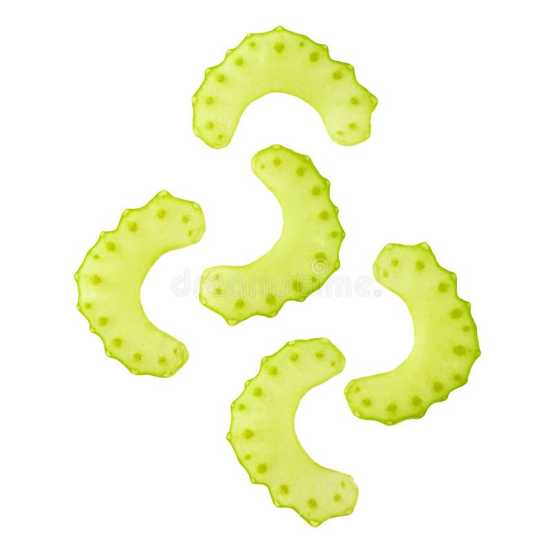 Several sliced celery stalk slices on a white background close-up. Isolated Top view. Several sliced celery stalk slices on a white background close-up. Isolated Top view