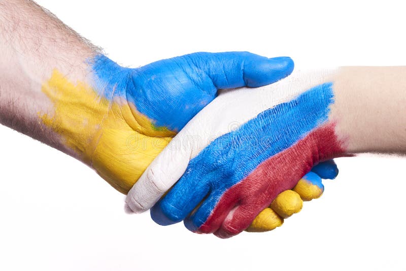 Flags of Ukraine and Russia Flag on hands isolated on white background. Concept of political, economical, social aggressions, disagreement. Flags of Ukraine and Russia Flag on hands isolated on white background. Concept of political, economical, social aggressions, disagreement.