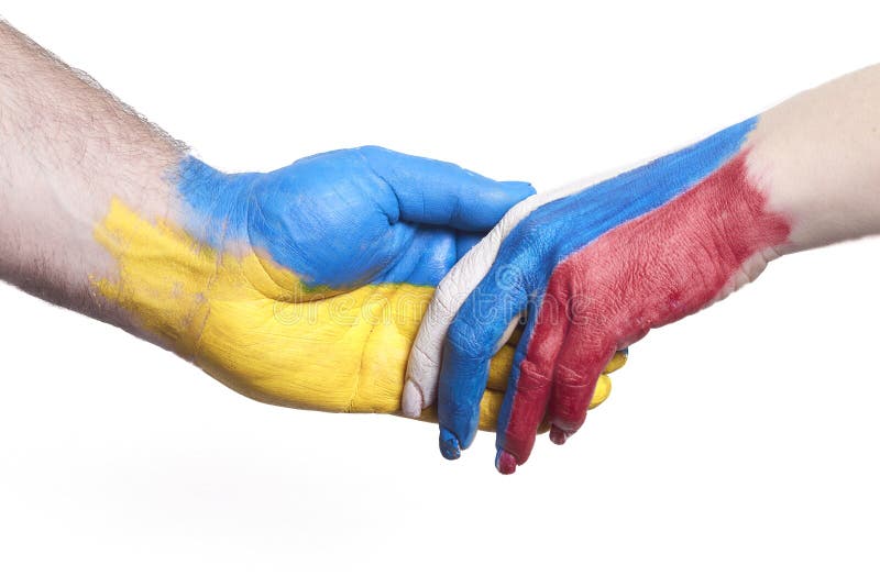 Flags of Ukraine and Russia Flag on hands isolated on white background. Concept of political, economical, social aggressions, disagreement. Flags of Ukraine and Russia Flag on hands isolated on white background. Concept of political, economical, social aggressions, disagreement.