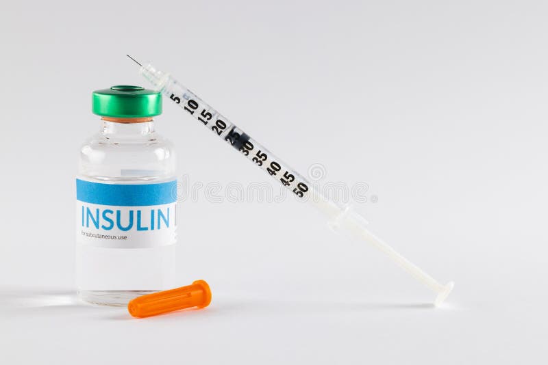 Insulin in vial and uncapped syringe on white background. Blood sugar, diabetes and health awareness. Insulin in vial and uncapped syringe on white background. Blood sugar, diabetes and health awareness.