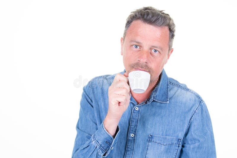A Studio shot handsome bearded man holding cup of hot drink coffee in white background. A Studio shot handsome bearded man holding cup of hot drink coffee in white background