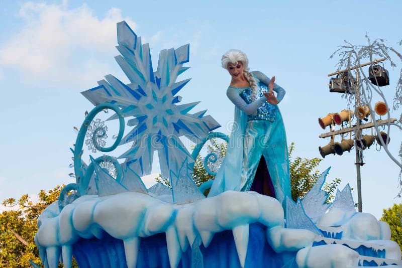 Elsa from the popular computer-animated musical fantasy-comedy is waving atop a beautiful blue and white snowy float in Disneyland's A Christmas Fantasy Parade. Very popular Christmastime parade at Disneyland. Elsa from the popular computer-animated musical fantasy-comedy is waving atop a beautiful blue and white snowy float in Disneyland's A Christmas Fantasy Parade. Very popular Christmastime parade at Disneyland.