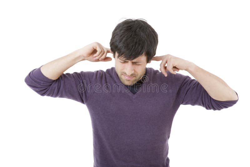 Handsome young man covering his ears, isolated white background. Handsome young man covering his ears, isolated white background