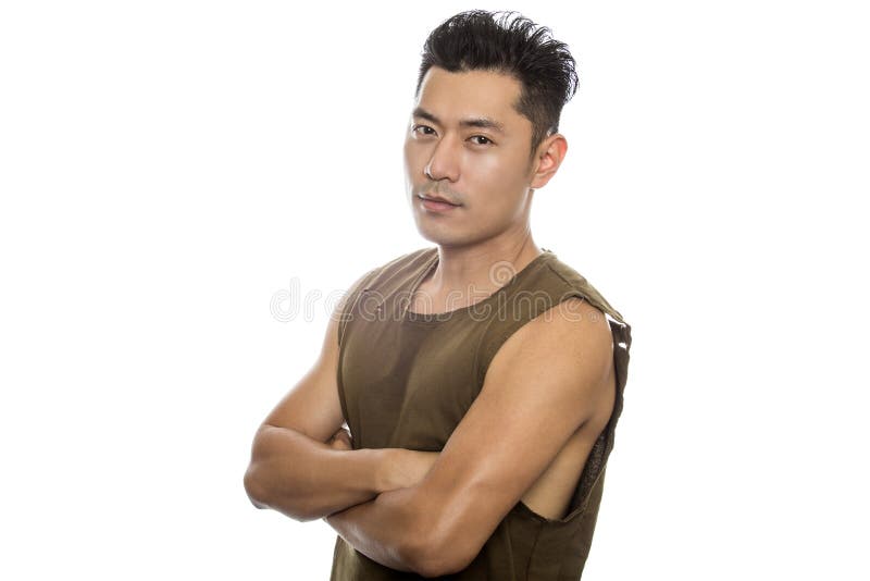 Athletic Asian male with trendy torn sleeveless shirt on a white background. He is displaying confident expressions or gestures. The handsome chinese or japanese man is muscular and physically fit. Athletic Asian male with trendy torn sleeveless shirt on a white background. He is displaying confident expressions or gestures. The handsome chinese or japanese man is muscular and physically fit