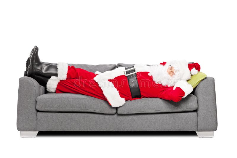 Santa Claus sleeping on a modern sofa isolated on white background. Santa Claus sleeping on a modern sofa isolated on white background