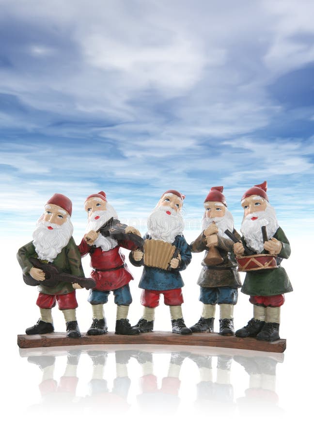 Five elves playing their music instruments at Christmas. Five elves playing their music instruments at Christmas