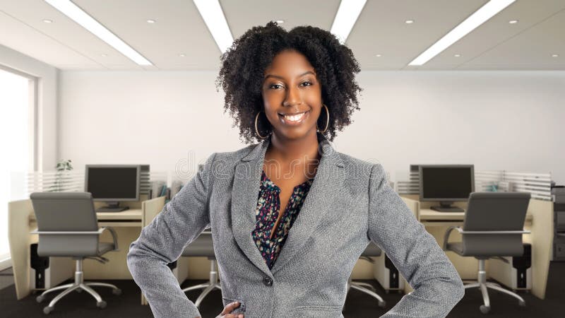 Black African American businesswoman in an office looking confident or arrogant.  She is an owner or an executive of the workplace.  Depicts careers and startup business. Black African American businesswoman in an office looking confident or arrogant.  She is an owner or an executive of the workplace.  Depicts careers and startup business