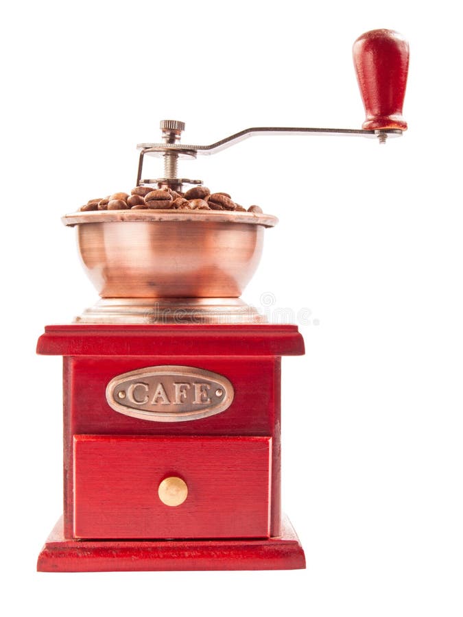 磨咖啡器用在白色背景隔绝的咖啡豆 库存图片