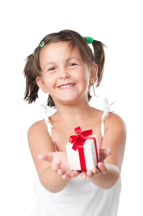 Happy smiling little girl holding and offering a gift for Christmas and birthday isolated on white background. Happy smiling little girl holding and offering a gift for Christmas and birthday isolated on white background