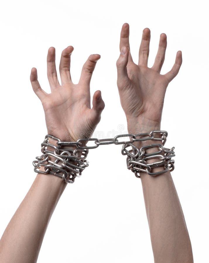 Social theme: hands tied a metal chain on a white background, studio. Social theme: hands tied a metal chain on a white background, studio