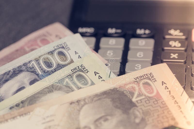 Peru money, Calculator and Peruvian banknotes, Budget and economics concept, Financial settlements in Peru. Peru money, Calculator and Peruvian banknotes, Budget and economics concept, Financial settlements in Peru