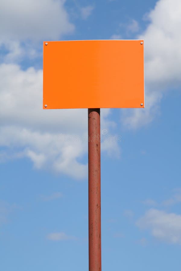 Empty orange sign post against the sky. Empty orange sign post against the sky