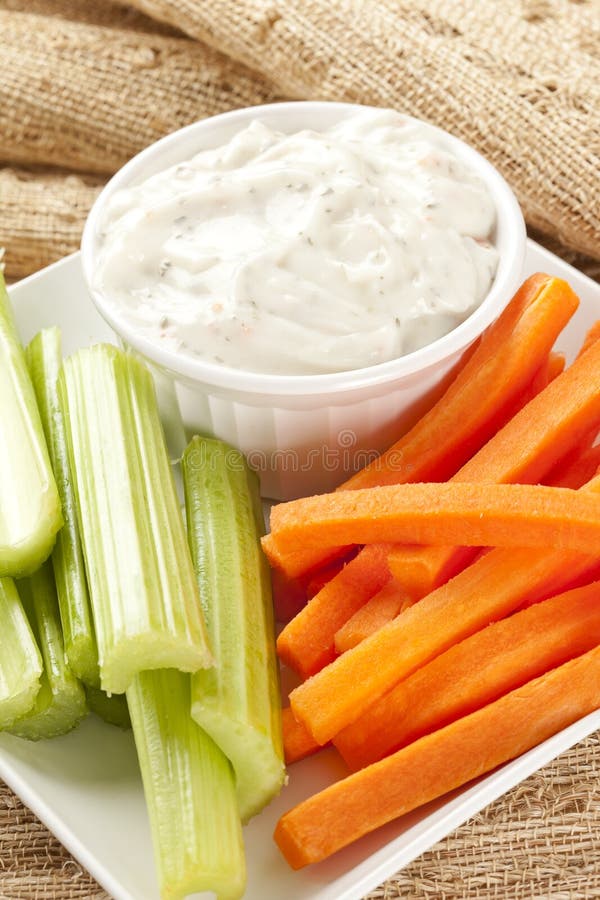 Ranch dressing with fresh carrots and celery. Ranch dressing with fresh carrots and celery