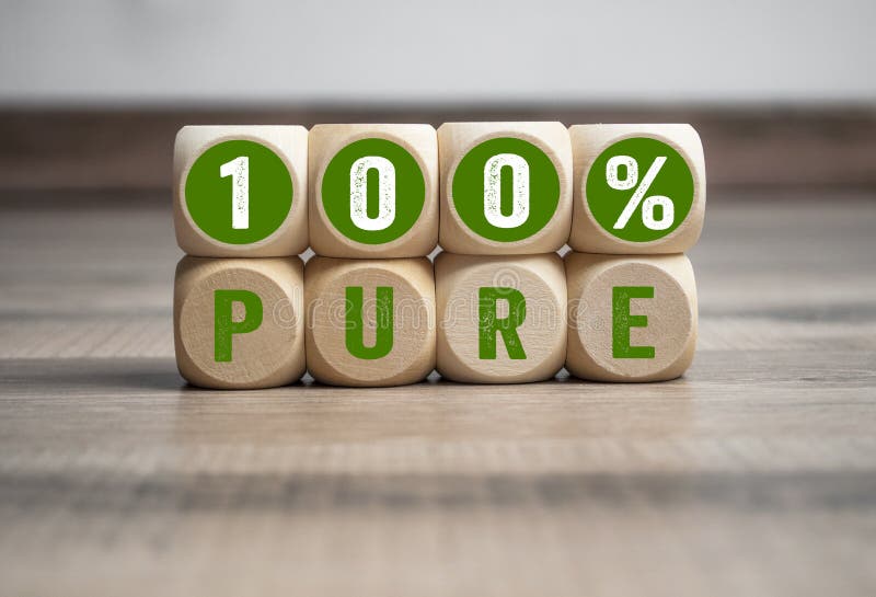 Cubes and dice with 100% pure on wooden background. Cubes and dice with 100% pure on wooden background