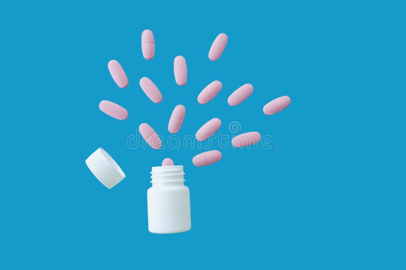 Pink large tablets fly out of small white clean plastic jar, the lid has flown off, blue background, isolated. Pink large tablets fly out of small white clean plastic jar, the lid has flown off, blue background, isolated.