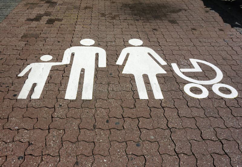 A designated parking spot at a supermarket intended only for families. A designated parking spot at a supermarket intended only for families