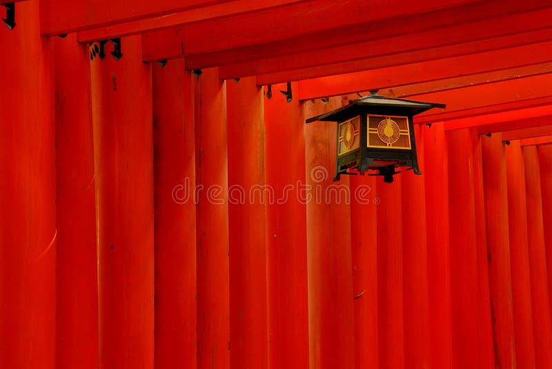 Detail of red torii gates and a lantern. Detail of red torii gates and a lantern.