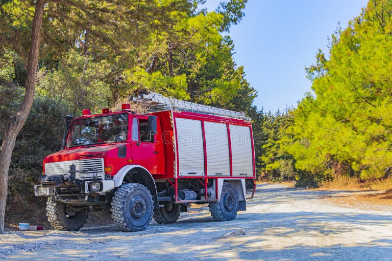 Red old fire truck on Filerimos hill in Ialysos forest on Rhodes in Greece. Red old fire truck on Filerimos hill in Ialysos forest on Rhodes in Greece