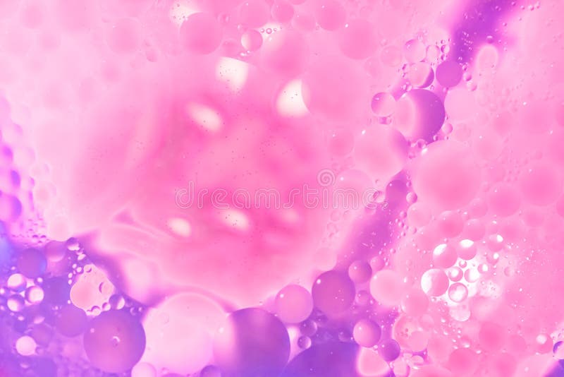 Background out of blue and white colored circles and drops, abstract light with white spot and magenta shine at the edges. Background out of blue and white colored circles and drops, abstract light with white spot and magenta shine at the edges