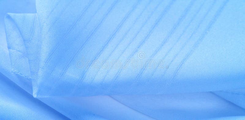 纹理背景，图案 丝绸蓝面料 从Telio看，这只透明透明硬纱的织法很薄，比. 纹理背景，图案 丝绸蓝面料 这只透明硬纱在Telio身上织出的细织，比丝纱布更粗更细 用这种豪华面料做任何事 这些可能性是无限的