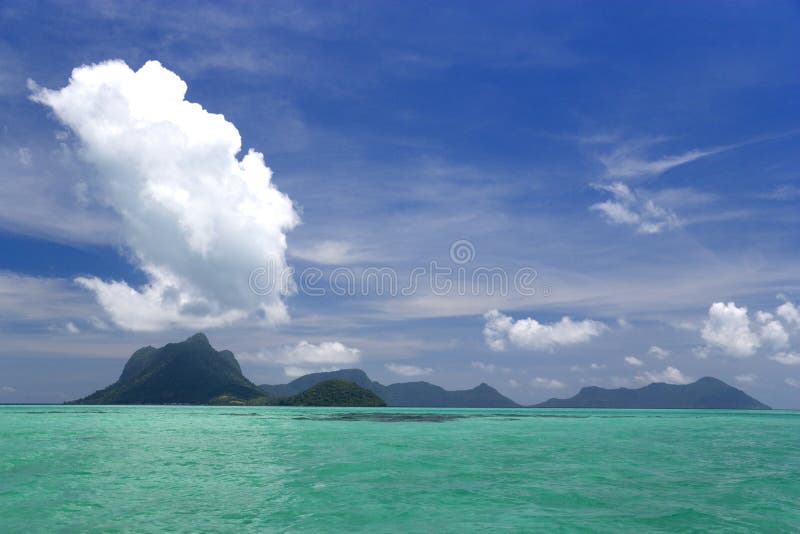 Image of remote Malaysian tropical islands that were formerly the rim of a volcano, now extinct. Image of remote Malaysian tropical islands that were formerly the rim of a volcano, now extinct.