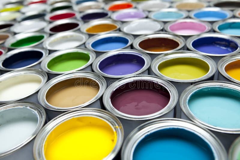 A colorful array of paint tins with shallow focus. A colorful array of paint tins with shallow focus.
