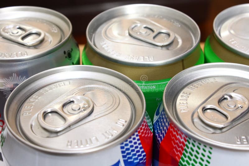 Rows of tins of canned soft drinks. Rows of tins of canned soft drinks