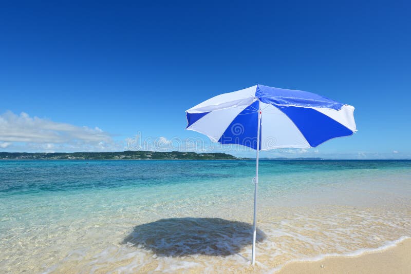 The beach and the beach umbrella of midsummer. The beach and the beach umbrella of midsummer.