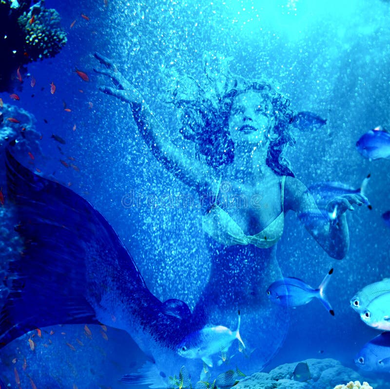 Girl mermaid dive underwater through coral fishes. Girl mermaid dive underwater through coral fishes.