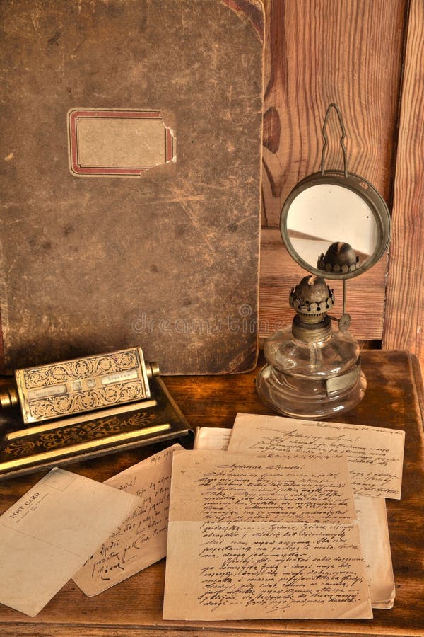 Old letters and card, calendar, oil-lamp and book on wooden background. Old letters and card, calendar, oil-lamp and book on wooden background.