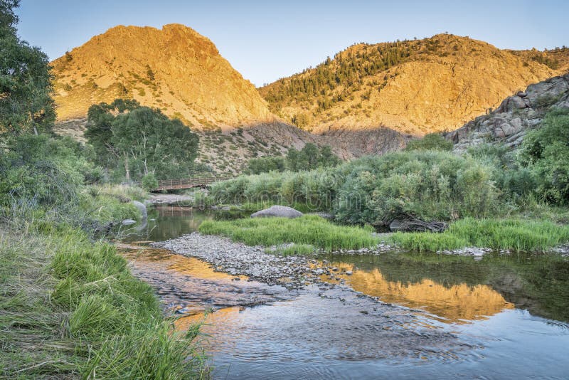 North Fork of Cache la Poudre River in Eagle Nest Open Space in northern Colorado at Livermore near Fort Collins, late summer sunset. North Fork of Cache la Poudre River in Eagle Nest Open Space in northern Colorado at Livermore near Fort Collins, late summer sunset