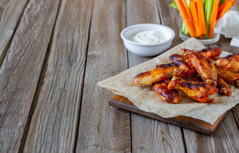 Barbecue chicken wings with carrots, celery and white sauce. Grill. Recipe. Barbecue chicken wings with carrots, celery and white sauce. Grill. Recipe