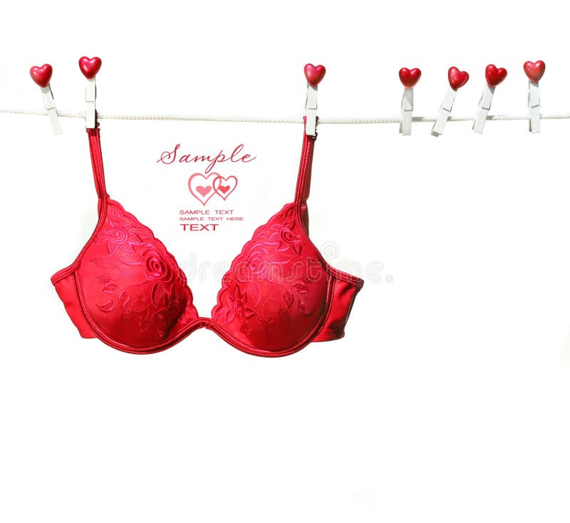 Fancy red bra hanging on clothesline with white background. Fancy red bra hanging on clothesline with white background