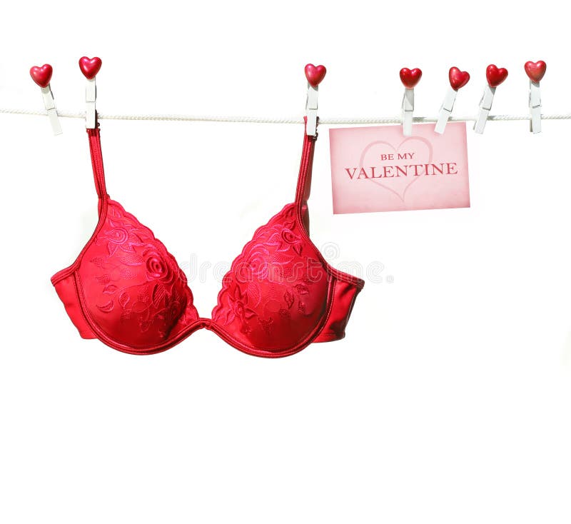 Fancy red bra hanging on clothesline with white background. Fancy red bra hanging on clothesline with white background