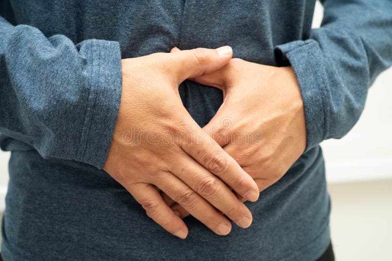 腹痛腹痛与疝气泌尿健康 库存图片