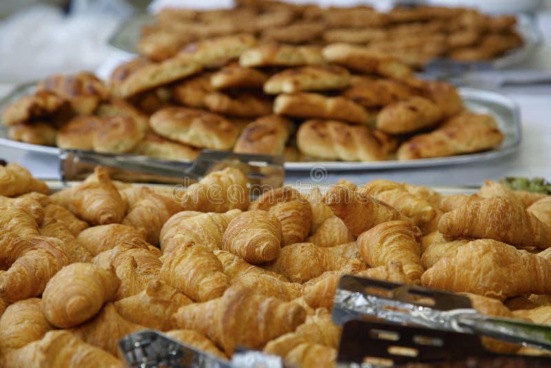 Detail of a Buffet with nuts and mini croissants. Detail of a Buffet with nuts and mini croissants