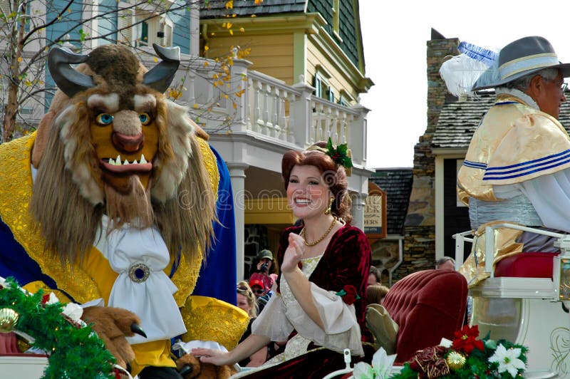 The Beast and Belle ride on a float in a Disney Christmas parade in Orlando, Florida. The Beast and Belle ride on a float in a Disney Christmas parade in Orlando, Florida.