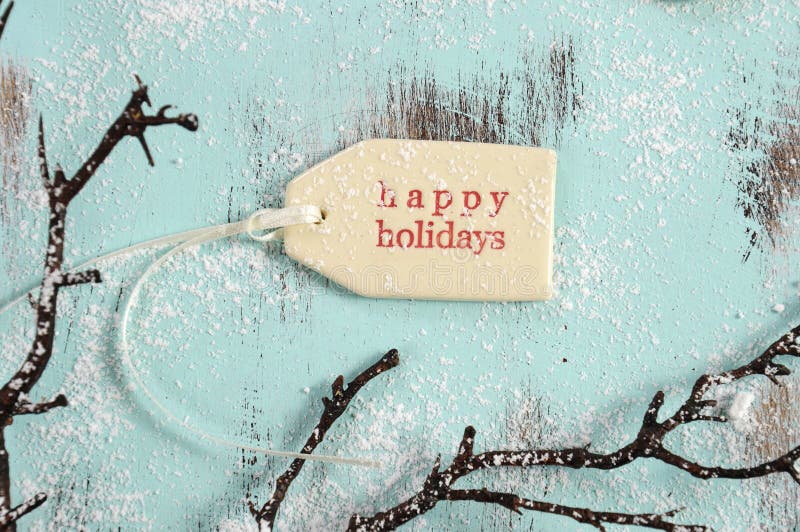 Merry Christmas festive baking concept with closeup on happy holidays gift tag on vintage style recycled wood background. Merry Christmas festive baking concept with closeup on happy holidays gift tag on vintage style recycled wood background.