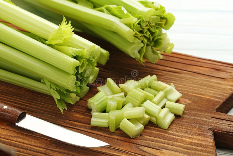 Celery on cutting board with knife. Celery on cutting board with knife