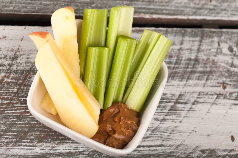 Celery and apple sticks with water above shot. Celery and apple sticks with water above shot