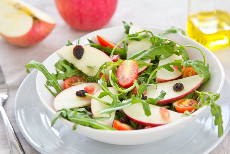 Fresh Apple,Pomegranate and Rocket salad in a bowl. Fresh Apple,Pomegranate and Rocket salad in a bowl
