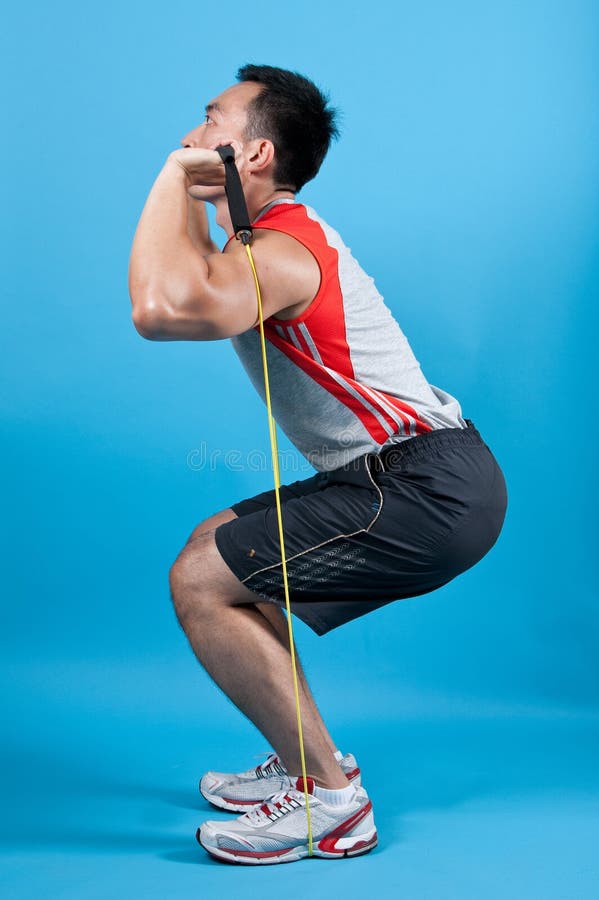 Young fit man with exercise stretch band. Young fit man with exercise stretch band