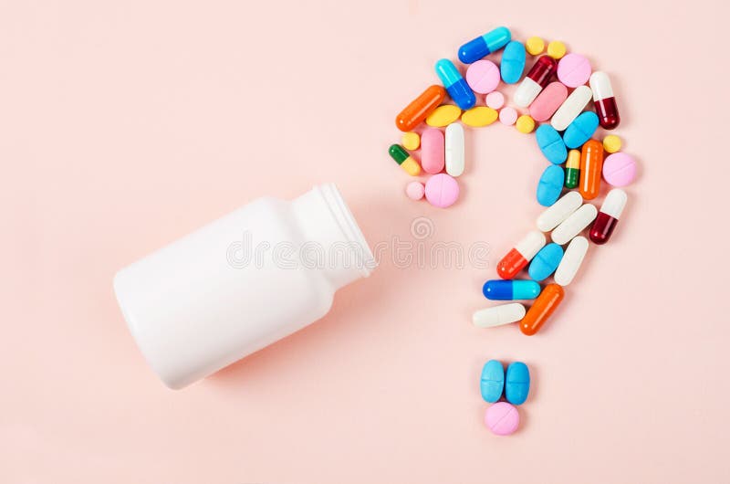 Pills or capsules as a question mark and white plastic bottle. Pills or capsules as a question mark and white plastic bottle.