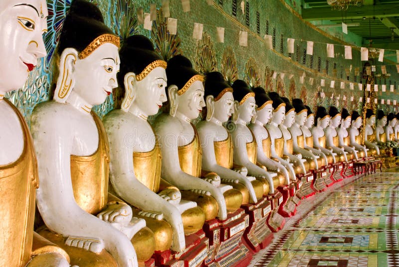 Row of buddha statues with golden robe in Myanmar (Burma). Row of buddha statues with golden robe in Myanmar (Burma)