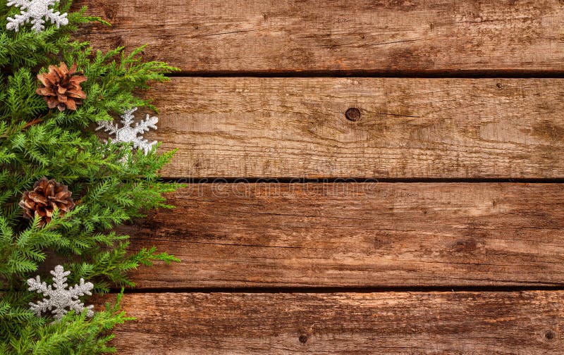 Vintage christmas background - old planked wood board with pine tree branch and decoration. Vintage christmas background - old planked wood board with pine tree branch and decoration