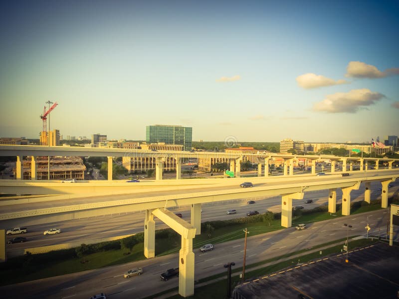 Vintage tone aerial view massive highway intersection, stack interchange with elevated road junction overpass in Houston, Texas, USA. Five-level freeway interchange carry heavy rush hour traffic. Vintage tone aerial view massive highway intersection, stack interchange with elevated road junction overpass in Houston, Texas, USA. Five-level freeway interchange carry heavy rush hour traffic