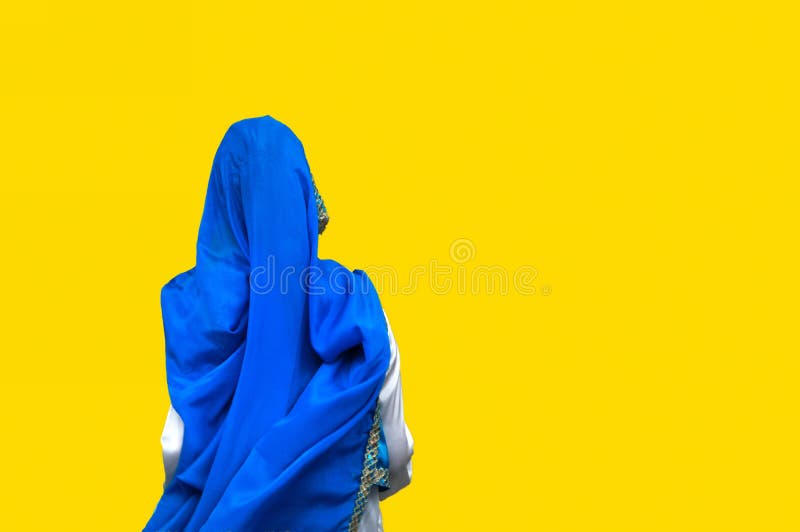 Blue robe against yellow background. Blue robe against yellow background