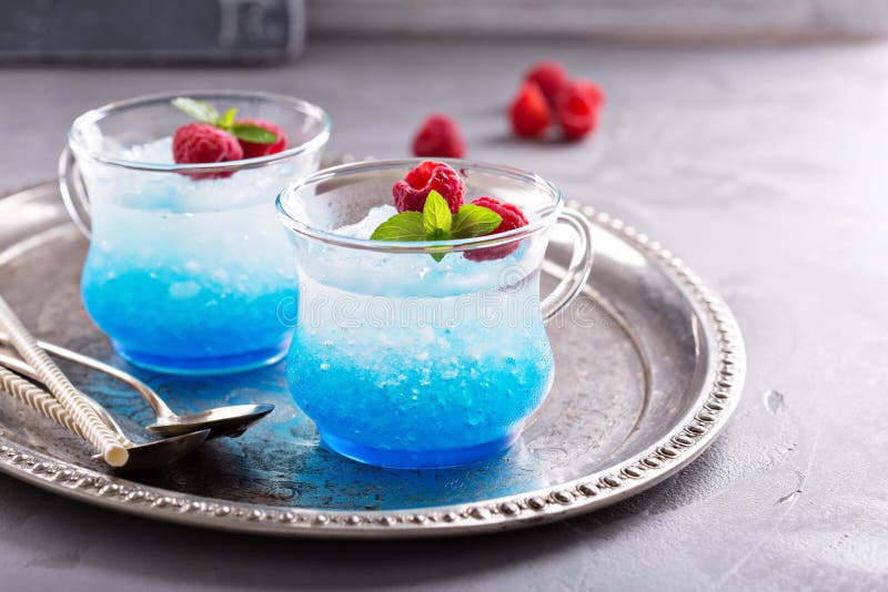 Blue raspberry cocktail with mint in small glass cups. Blue raspberry cocktail with mint in small glass cups