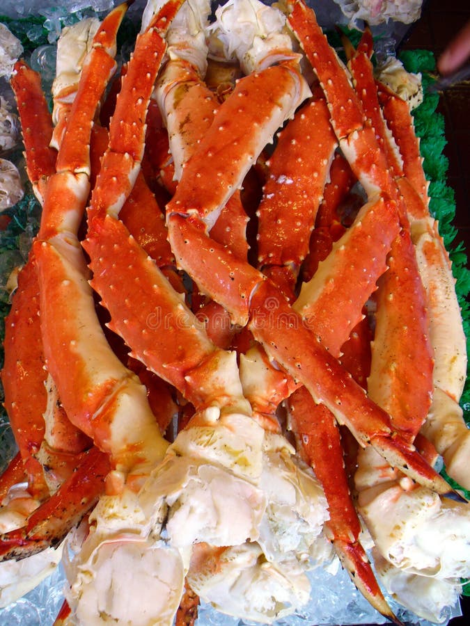 Photo of King Crab legs shipped from Alaska for sale in a Washington D.C. fish market. This seafood will make a delicious meal. Photo of King Crab legs shipped from Alaska for sale in a Washington D.C. fish market. This seafood will make a delicious meal.