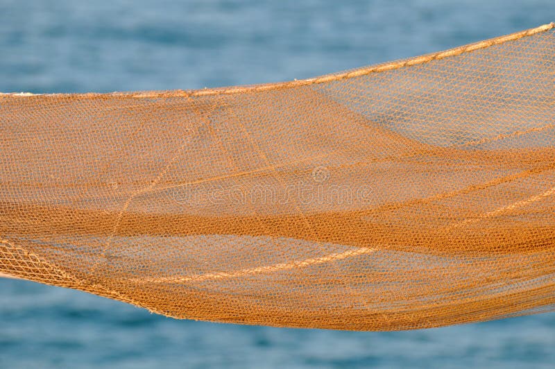 A orange fishing net. Net bag. A orange fishing net. Net bag.